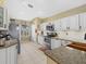 Bright kitchen featuring an island, stainless steel appliances, and white cabinetry at 8222 Haven Harbour Way, Bradenton, FL 34212