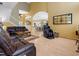 Spacious living room with leather sofas, wooden floors, and open layout at 8222 Haven Harbour Way, Bradenton, FL 34212