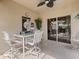 Covered patio with comfortable seating, perfect for outdoor dining and relaxation with a Steelers decor at 8222 Haven Harbour Way, Bradenton, FL 34212