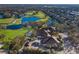 This aerial view highlights the golf course, clubhouse, water features, and lush landscaping at 8706 52Nd E Dr, Bradenton, FL 34211