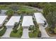 An aerial view shows homes with well-kept lawns, mature landscaping, and paver driveways at 8706 52Nd E Dr, Bradenton, FL 34211