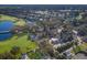 Aerial view highlighting the community golf course, the clubhouse, and the community's lush landscaping at 8706 52Nd E Dr, Bradenton, FL 34211