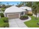Aerial view of a home shows a well-maintained exterior, and lush landscaping at 8706 52Nd E Dr, Bradenton, FL 34211