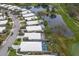 Aerial shot shows homes along a golf course with community lake views at 8706 52Nd E Dr, Bradenton, FL 34211