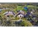 Expansive clubhouse featuring well-kept landscaping, a golf course, and ample parking at 8706 52Nd E Dr, Bradenton, FL 34211