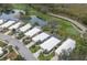 An aerial view shows homes with golf course and pond views at 8706 52Nd E Dr, Bradenton, FL 34211