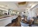 An inviting bar area with wood floors, TVs, and comfortable seating in a spacious, open layout at 8706 52Nd E Dr, Bradenton, FL 34211