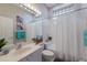 Well-lit bathroom with a vanity, decorative art, and a shower-tub combo at 8706 52Nd E Dr, Bradenton, FL 34211