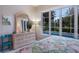 Bedroom with backyard pool views, a light wood dresser, and a comfortable bed at 8706 52Nd E Dr, Bradenton, FL 34211