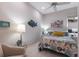 Cozy bedroom with colorful bedding, side tables, and a decorative fish on the wall at 8706 52Nd E Dr, Bradenton, FL 34211