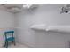 Walk-in closet with white wire shelving and a teal-colored chair at 8706 52Nd E Dr, Bradenton, FL 34211