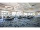 A bright dining room features plenty of seating and natural light from large windows, creating a welcoming atmosphere at 8706 52Nd E Dr, Bradenton, FL 34211