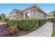 Charming single-story home with a well-manicured lawn and lush landscaping at 8706 52Nd E Dr, Bradenton, FL 34211