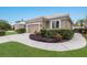 Charming single-story home with a well-manicured lawn and lush landscaping at 8706 52Nd E Dr, Bradenton, FL 34211