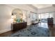 Hallway showcasing a decorative rug, buffet table, and doorway to the dining area at 8706 52Nd E Dr, Bradenton, FL 34211