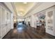 Hallway featuring an arched ceiling and an opening to the bar and restaurant area at 8706 52Nd E Dr, Bradenton, FL 34211