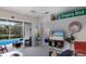 Bright living room with pool views, stylish decor, and cozy seating at 8706 52Nd E Dr, Bradenton, FL 34211