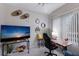 Inviting home office with a modern desk, a large TV, and a comfortable chair at 8706 52Nd E Dr, Bradenton, FL 34211