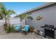Inviting patio with a grill, comfortable seating, and tropical decor at 8706 52Nd E Dr, Bradenton, FL 34211