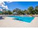Large outdoor swimming pool with lounge chairs at 8706 52Nd E Dr, Bradenton, FL 34211