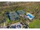 Aerial image of community tennis courts and pool, surrounded by trees at 8706 52Nd E Dr, Bradenton, FL 34211