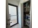 Organized closet with shelves, and a door that leads to outdoor patio at 8977 Midnight Pass Rd # 521, Sarasota, FL 34242