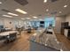 Spacious community room with round tables and comfortable seating at 8977 Midnight Pass Rd # 521, Sarasota, FL 34242