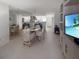 Clean dining area features a mirrored wall and views into the kitchen at 8977 Midnight Pass Rd # 521, Sarasota, FL 34242