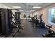Bright gym featuring a variety of cardio and strength training equipment at 8977 Midnight Pass Rd # 521, Sarasota, FL 34242