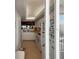 A bright kitchen with white cabinets and appliances, offering a glimpse of the ocean view at 8977 Midnight Pass Rd # 521, Sarasota, FL 34242