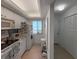 Bright and efficient kitchen with white appliances, providing an ocean view at 8977 Midnight Pass Rd # 521, Sarasota, FL 34242