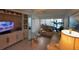 Cozy living room with built-in shelving, entertainment center and ample seating at 8977 Midnight Pass Rd # 521, Sarasota, FL 34242