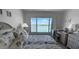 Relaxing main bedroom with a king bed, waterfront views, and bright interior at 8977 Midnight Pass Rd # 521, Sarasota, FL 34242