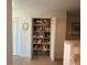 Pantry featuring shelving stocked with food and supplies, maximizing storage space at 8977 Midnight Pass Rd # 521, Sarasota, FL 34242
