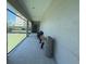 Covered walkway with tennis court view at 8977 Midnight Pass Rd # 521, Sarasota, FL 34242