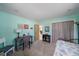 This bedroom offers light blue walls, carpet floors, and an open closet at 9089 Berendo Ave, Englewood, FL 34224
