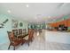 Spacious living space with dining area that connects to a modern kitchen at 9089 Berendo Ave, Englewood, FL 34224