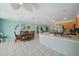 Open-concept living space featuring dining area and a glimpse of the kitchen at 9089 Berendo Ave, Englewood, FL 34224