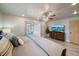 Bright bedroom with a king size bed, ceiling fan and sliding glass doors leading to outdoor space at 9089 Berendo Ave, Englewood, FL 34224