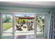 Cozy patio with comfortable seating around a fire pit, complemented by a view of the outdoor kitchen at 9089 Berendo Ave, Englewood, FL 34224