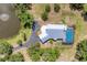 Breathtaking aerial shot of the property, showcasing the home, pool, and surrounding lush greenery at 919 Palm View Way, Sarasota, FL 34240