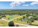 Two grand properties with a ponds, long driveways, lush greenery, and privacy at 919 Palm View Way, Sarasota, FL 34240