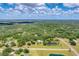 Expansive aerial view of a community with homes and verdant surroundings at 919 Palm View Way, Sarasota, FL 34240