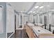 Upstairs bathroom has double sinks, glass shower, and hardwood floors at 919 Palm View Way, Sarasota, FL 34240
