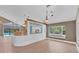 Bright living room featuring a bar with a window and a view of the lush backyard at 919 Palm View Way, Sarasota, FL 34240