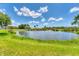 Picturesque pond with a fountain, adding a serene and calming element to the lush landscape at 919 Palm View Way, Sarasota, FL 34240