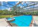 Captivating screened-in pool and spa with tiled accents, ideal for unwinding in style and comfort at 919 Palm View Way, Sarasota, FL 34240