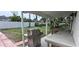 Backyard featuring a grill, countertop, privacy fence and tropical greenery at 1016 Rhodes Ave, Sarasota, FL 34237