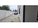 Backyard exterior view features a privacy fence, landscaping, and outdoor seating at 1016 Rhodes Ave, Sarasota, FL 34237