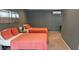 Cozy bedroom with two beds, offering a comfortable and inviting space for relaxation at 1016 Rhodes Ave, Sarasota, FL 34237